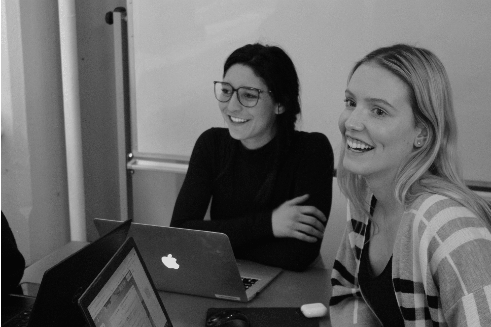 Sales Talent Agency recruiters collaborating at a laptop